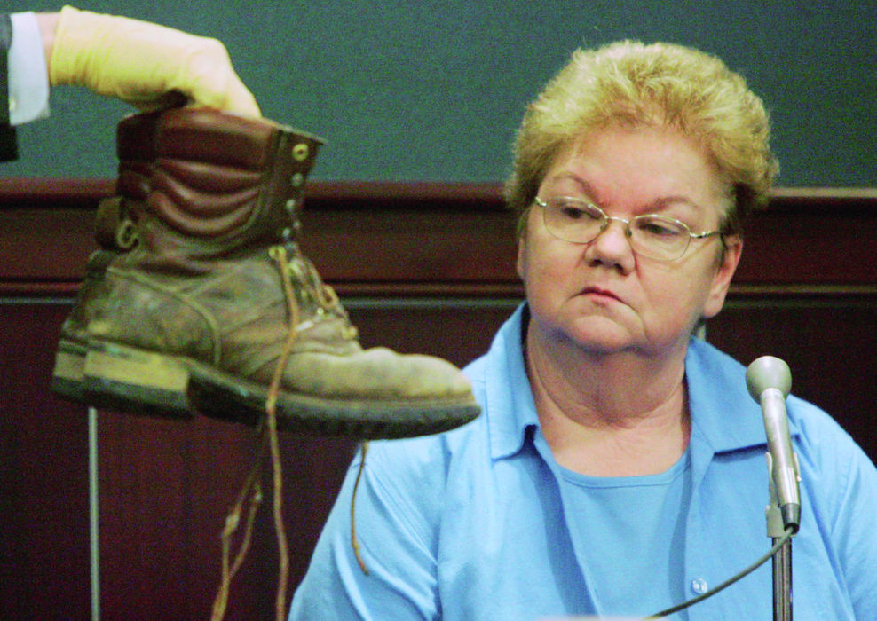 Third Place, Team Picture Story - Mike Cardew / Akron Beacon JournalKaye Busta, mother of star prosecution witness Troy Busta, testifies  in Randy Resh's retrial about the boots her son has said he was wearing the night Connie Nardi was killed. Troy Busta, the sole eyewitness claims that he was wearing these boots on the night Connie Nardi was murdered in 1988.