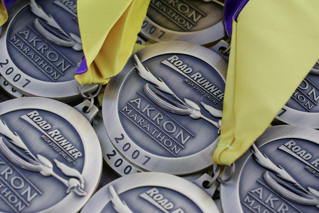 Award of Excellence, Team Picture Story - Bob DeMay / Akron Beacon JournalMedals await the winners at the finish line of the 5th annual Road Runner Akron Marathon at Canal Park.