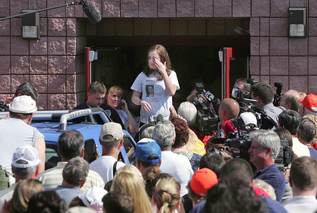 First Place, Team Picture Story - Phil Masturzo / Akron Beacon JournalWhitney Davis, sister of Jessie Marie Davis, who is pregnant, addresses volunteers at the Greentown Fire Department before the search. "We want to bring her and Chloe back," she said.