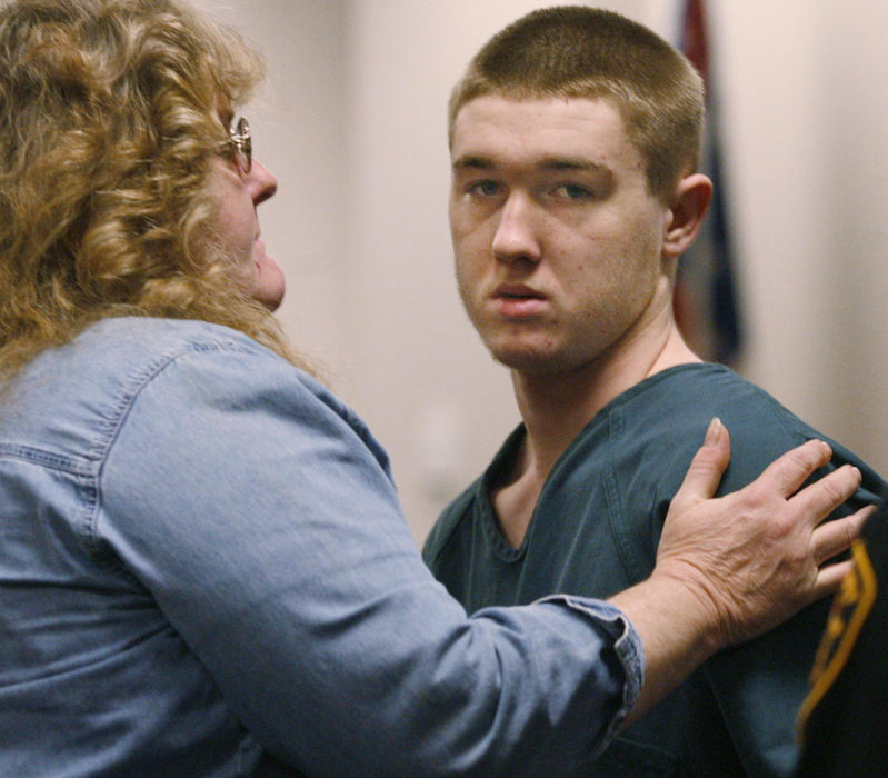 Award of Excellence, Team Picture Story - Amy E. Voigt / The BladeSuspects mother Diane Jobe (left) comforts her son suspect Robert Jobe following his hearing.  Juvenile court detention hearing for suspected vice detective shooter Robert Jobe, 15, before judge James Ray.