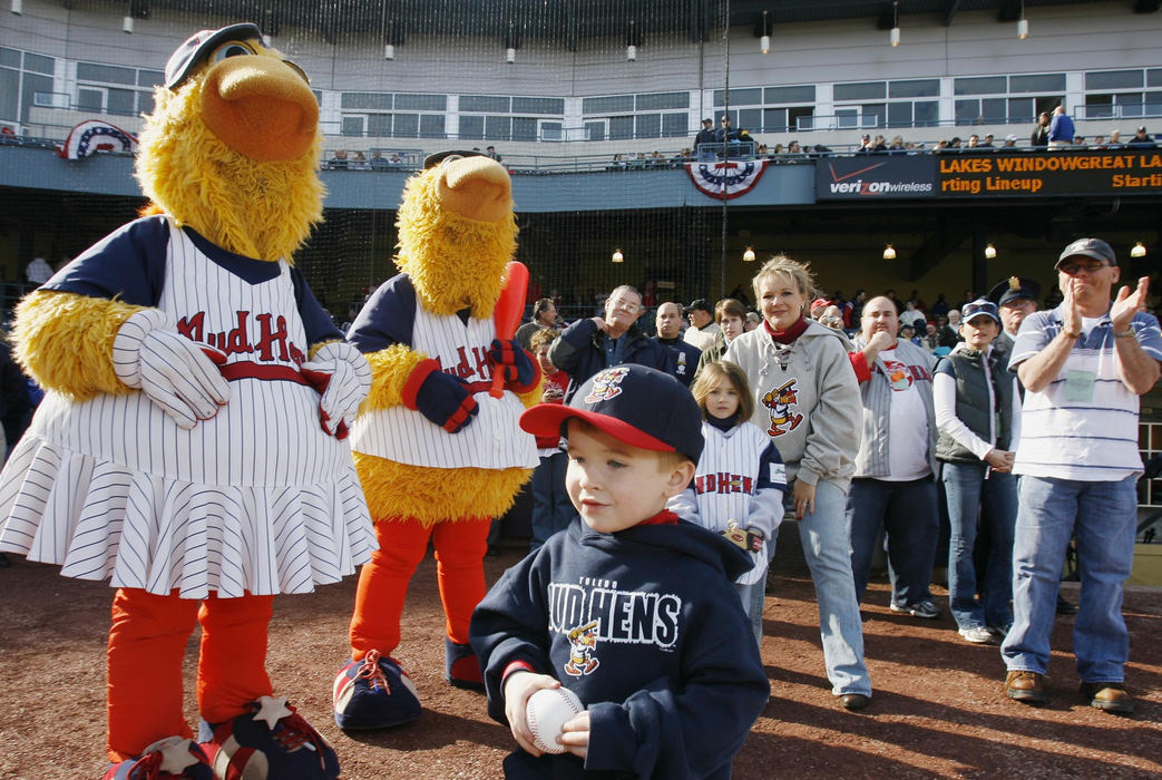 Award of Excellence, Team Picture Story - Jeremy Wadsworth / The BladeNoah Dressel, son of Detective Keith Dressel, is cheered by Muddy, Muddonna, his sister Sydney Durham, and his mother Danielle Dressel prior to throwing out the first pitch at the Home Opener  of the Toledo Mud Hens.