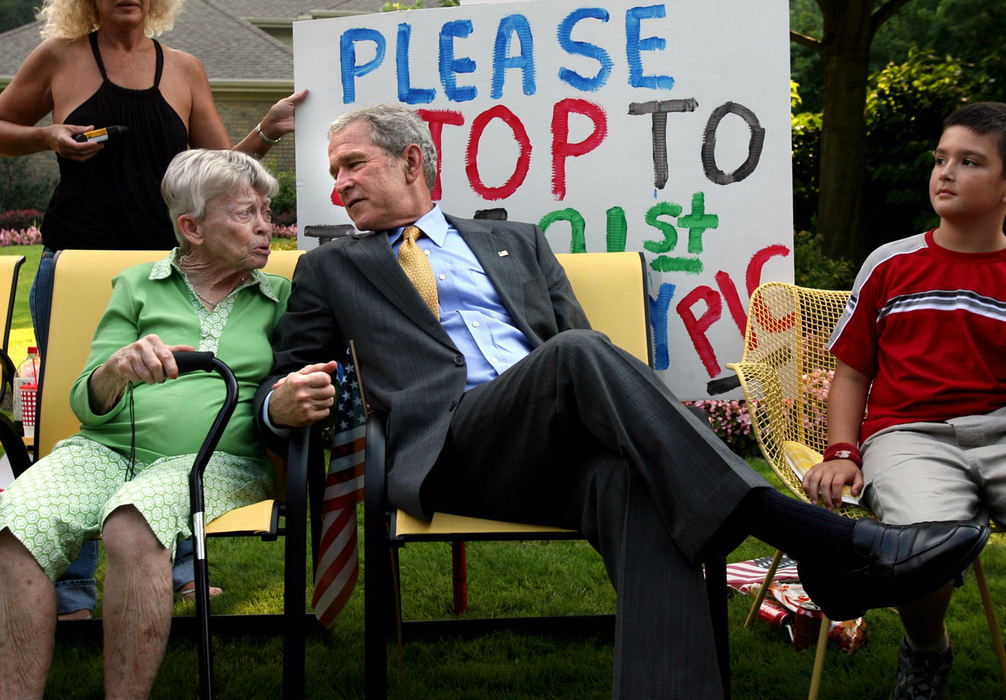 First Place, Campaign 2008 - Lisa DeJong / The Plain DealerRuth Harris got a president for her 91st birthday when President George W. Bush stopped to sit next to her after leaving his Republican fund-raiser for John McCain in Gates Mills. Harris sat in her front yard with a sign that read, "Please stop to take 91st Birthday Pic." 