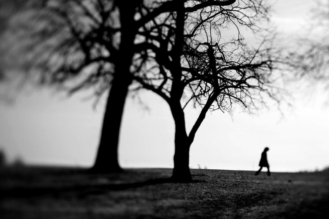 Second Place, Feature Picture Story - Lisa DeJong / The Plain DealerJoanna Connors walks across the grounds at Pickaway Correctional Institution, one of the many stops on her journey to find out about the life of her attacker, David Francis. Francis spent time at this prison in southern Ohio. "I knew he had gone to prison," Connors writes. " Beyond that, I didn't know much more than his name. Yet, if I made a list of the most influential people in my life, Dave would be near the top. He had controlled so much of how I lived my life."