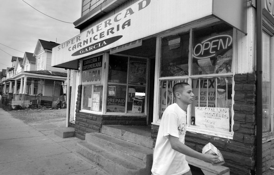 Third Place, Feature Picture Story - Carrie Cochran / The Cincinnati EnquirerThe Fourth Ward on East Avenue at Hanover Street in Hamilton has the most heavily concentrated Hispanic population in the city. Butler County's 8,200 Hispanic immigrants make up only 2.3% of the population here, but they are changing the social, political and economic landscape of the county.