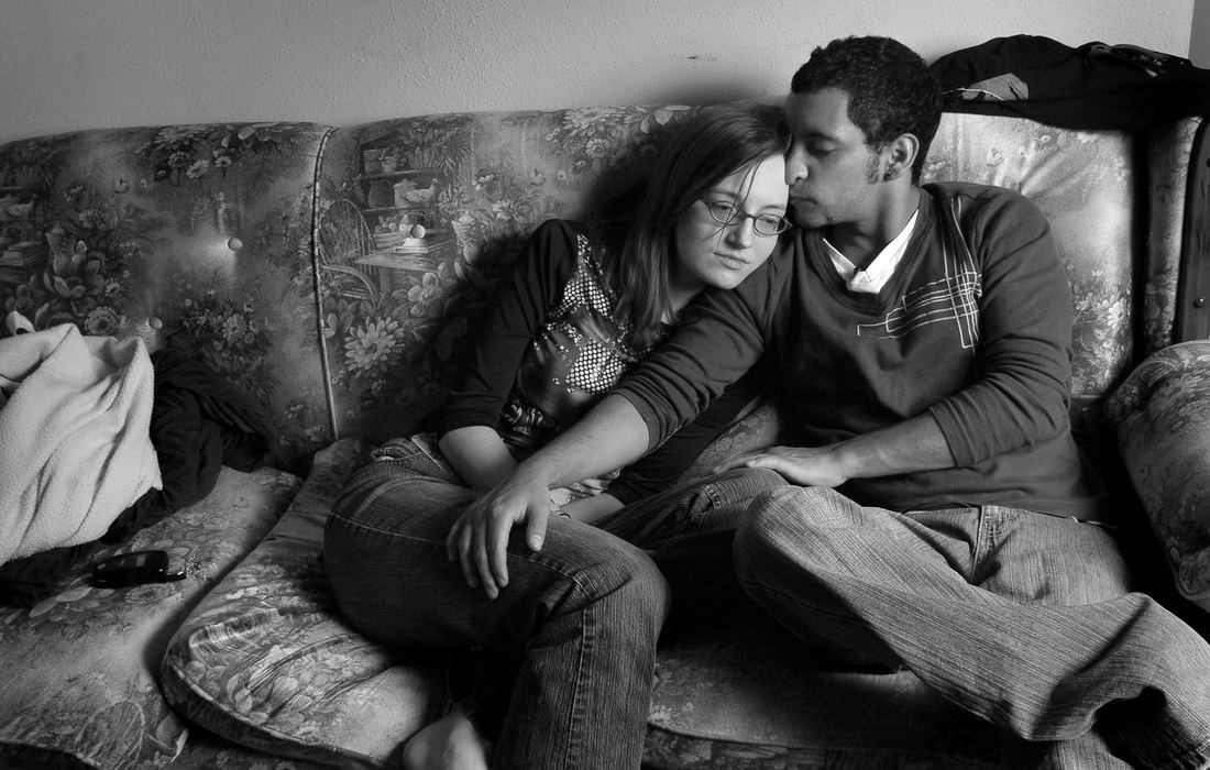 Third Place, Feature Picture Story - Carrie Cochran / The Cincinnati EnquirerLuis Pajares Landa, 22, and his wife, LoriAnn Klatte, 21, sit in their Fairfield apartment, in limbo. They had been married for seven months when I.C.E. raided Koch Foods, a factory where Pajares was working illegally packaging chicken parts. Pajares has a son in Peru, 19-month-old Lucas Pajares, to whom he sends money for food and clothes. 