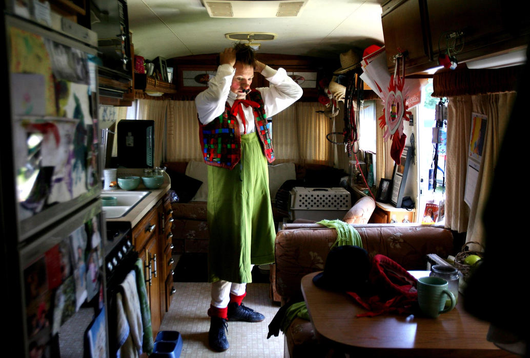 Award of Excellence, Feature Picture Story - Lisa DeJong / The Plain DealerGiovanni Zoppe dresses up as "Nino" inside his crowded trailer before his show at the Great Lakes Medieval Faire. The Zoppe Family Circus travels constantly in the summer, living with family and animals in tight spaces. 
