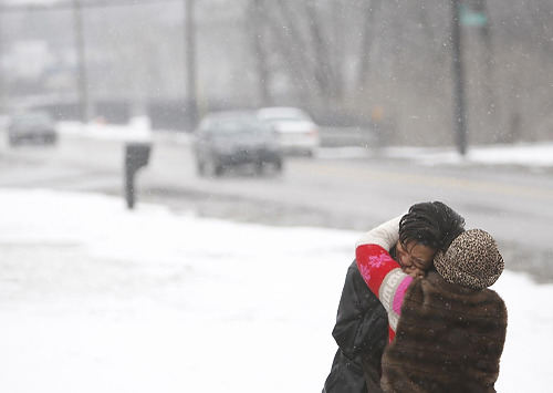 First Place, Feature Picture Story - Chris Russell / The Columbus DispatchLaDawnya is comforted by a relative after returning to the site at Blake and Joyce Avenues where her son Melvin was killed almost one year earlier.  The trial for his killer was scheduled to begin within a month.