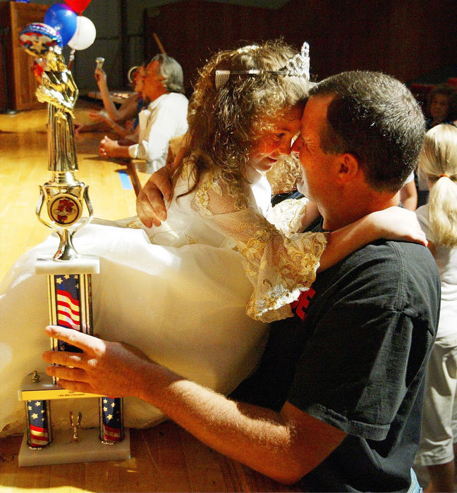 Award of Excellence, General News - Chris Parker / ThisWeek NewspapersDaylyn Merkle shares a moment with her father, Bryan, after winning the Little Miss Firecracker Pageant 2008, July 3, 2008.