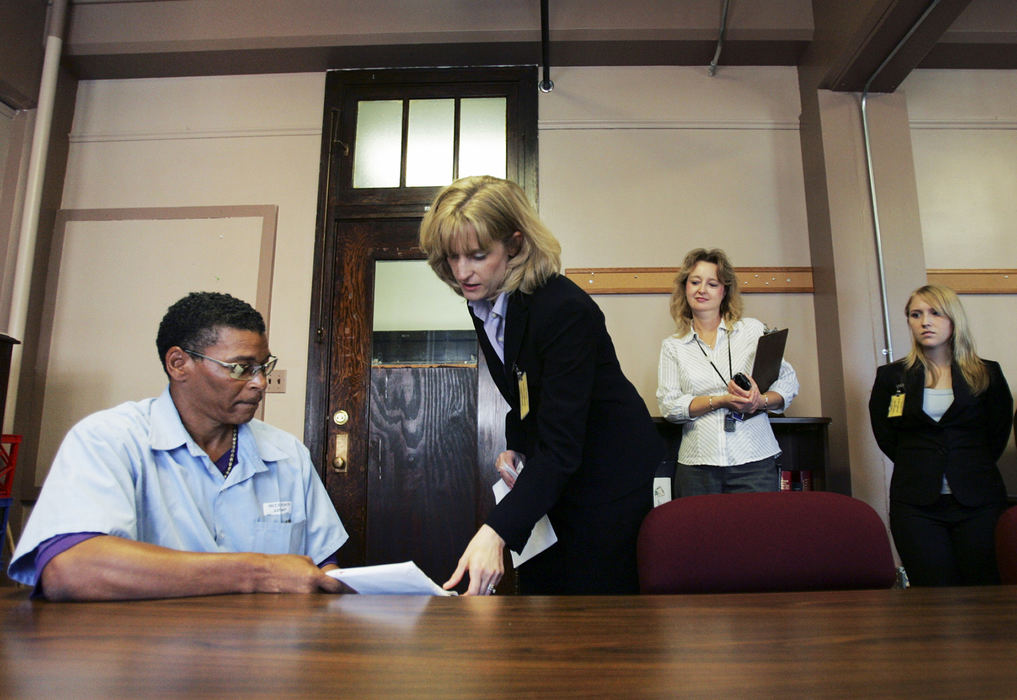 Third Place, News Picture Story - Shari Lewis / The Columbus DispatchOhio Innocence Project attorney Jennifer Paschen Bergeron delivers the results of the DNA test to inmate Robert McClendon. "Hello truth," McClendon exclaimed. The Ohio Innocence Project believes that this is a clear exoneration of McClendon.