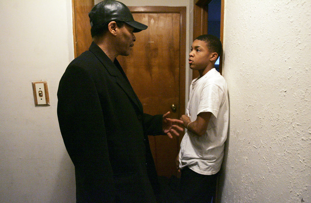 Third Place, News Picture Story - Shari Lewis / The Columbus DispatchRobert McClendon has a talk with his oldest grandson Donavin Miller, 13, after finding out that he was suspended from school. McClendon said that he wants to be a positive male figure in his grandkids' life to help guide them as they grow up. He believes that they will listen to what he has to say because of his experiences.