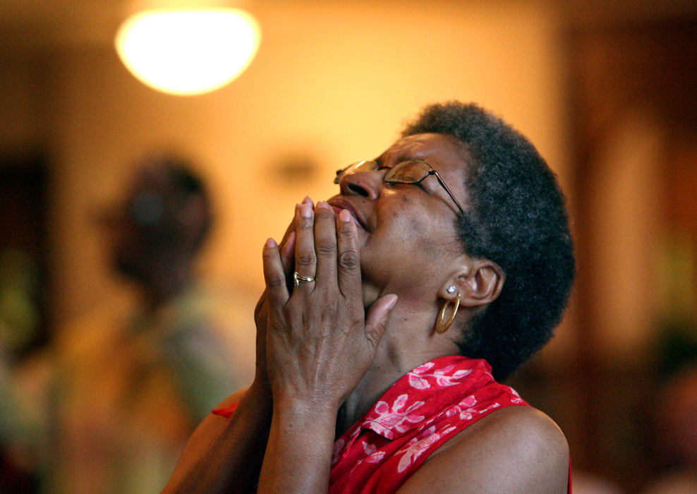 Award of Excellence, News Picture Story - Tracy Boulian / The Plain DealerWhile the pews were once full, the congregation now has less than half the membership of the past.Those that remain are mostly elderly members. Patricia Bell is one of those remaining members who takes in the music during a Sunday service at Emmanuel Baptist Church on August 3, 2008. 