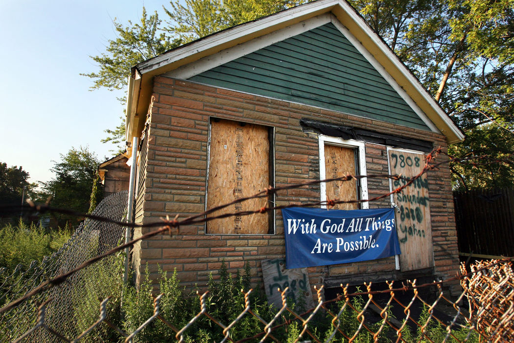 Award of Excellence, News Picture Story - Tracy Boulian / The Plain DealerReligion is a central piece of the neighborhood surrounding E. 79th Street and Quincy Avenue in Cleveland, where Emmanuel Baptist Church stands. For many, there is little to look to but faith in this crime-ridden area. Down the street from Emmanuel, barbed wire protects an abandoned building, on which a sign hangs "With God All Things Are Possible." And every Sunday, numerous churches open their doors to those in the community and those willing to continue to travel to the area.