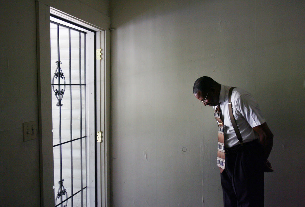 Award of Excellence, News Picture Story - Gus Chan / The Plain DealerThe Rev. Virgil Hasbery inside the home he purchased on E. 71 St. that serves as transitional housing for former drug addicts and a church home for his Old Landmark Christian Ministries.