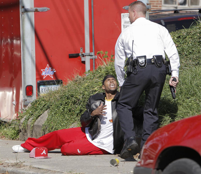 First Place, News Picture Story - Fred Squillante / The Columbus DispatchColumbus police Sgt. Rich Weiner detains a man who ran from an alley where shots were fired.