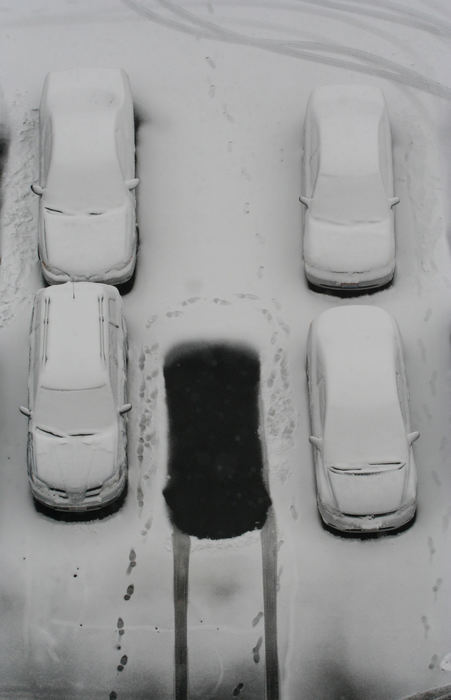 First Place, Pictorial - Karl Kuntz / The Columbus DispatchAn empty parking space shows the contrast between the snowfall and the recently emptied spot.  Many downtown workers went home early to avoid the mounting snow and the possible problems at rush hour. 