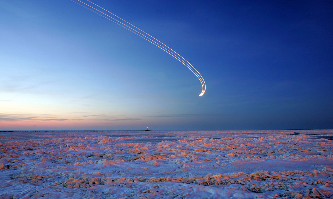 Award of Excellence, Pictorial - Joshua Gunter / The Plain DealerA 30-second time exposure captures the lights of an airplane over a frozen Lake Erie as it prepares for a landing at Burke Lakefront Airport March 13, 2008 in Cleveland. Photographed from E. 55 St. Marina area.  