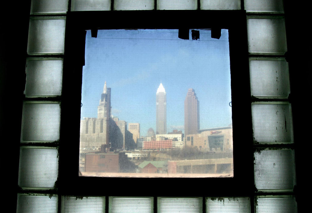 Award of Excellence, Pictorial - Chuck Crow / The Plain DealerAn old time look at the Cleveland skyline from an old time fire station, the old Cleveland Fire Station #28 on Carnegie Ave. just off of Ontario St. in Cleveland, on Jan. 18, 2008. The old fire station will be converted into the Western Reserve Fire Museum and Education Center after fund-raising drives kick off this year.