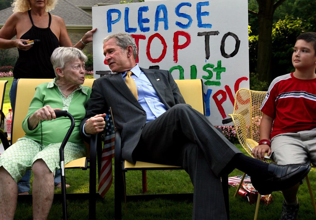First Place, Photographer of the Year - Lisa DeJong / The Plain DealerRuth Harris got a president for her 91st birthday Tuesday when President George W. Bush stopped to sit next to her after leaving his Republican fund-raiser for John McCain in Gates Mills. Harris sat in her front yard with a sign that read, "Please stop to take 91st Birthday Pic." 