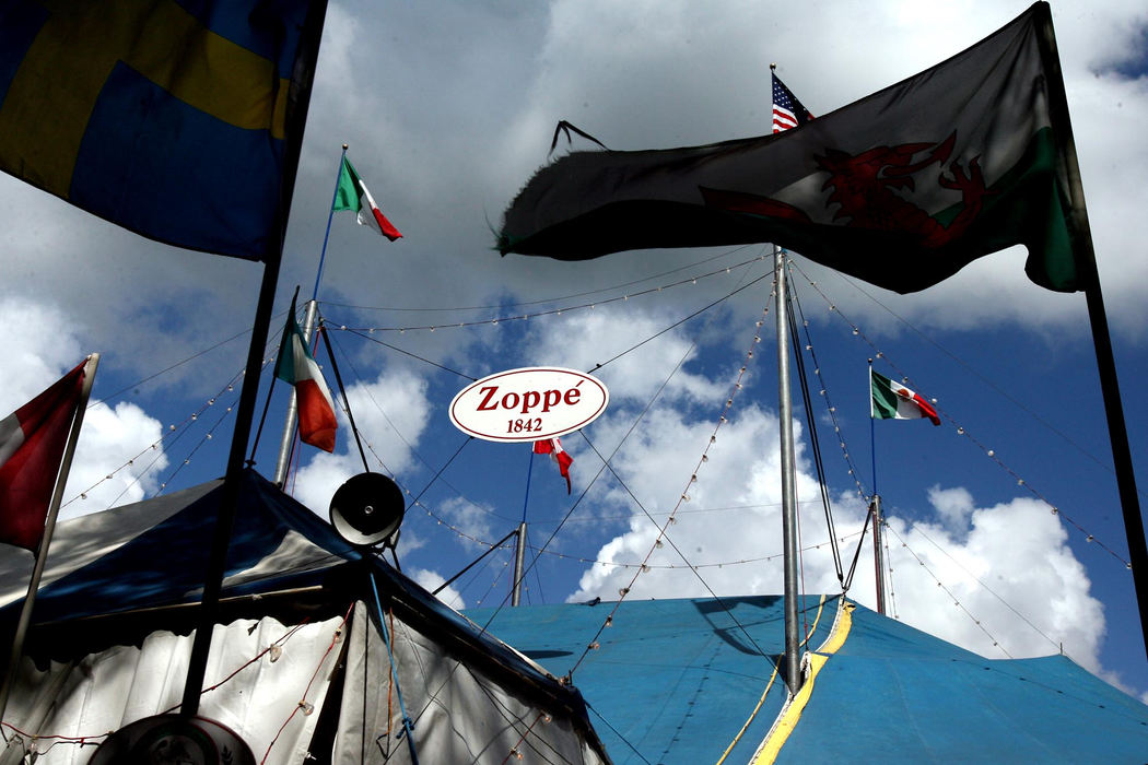 First Place, Photographer of the Year - Lisa DeJong / The Plain DealerThe Zoppe Family Circus welcomes guests hungry for the old-world, traditional Italian circus experience. The 50-foot tent, erected strictly by man-power alone, houses the one-ring circus with 500 seats. Giovanni Zoppe,  who now runs the circus, is a sixth-generation circus performer who grew up in his family's circus. The Zoppe Family Circus started in Italy in 1842 and was brought to the United States by his father Alberto Zoppe where the traveling circus performs in almost all of the 50 states.