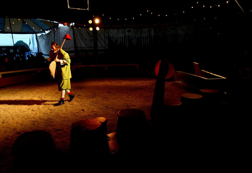 First Place, Photographer of the Year - Lisa DeJong / The Plain DealerGiovanni Zoppe performs to a packed house as the clown 'Nino" inside their one-ring tent .  The 50-foot-tall tent, erected strictly by man-power alone, houses the one-ring circus with 500 seats. 
