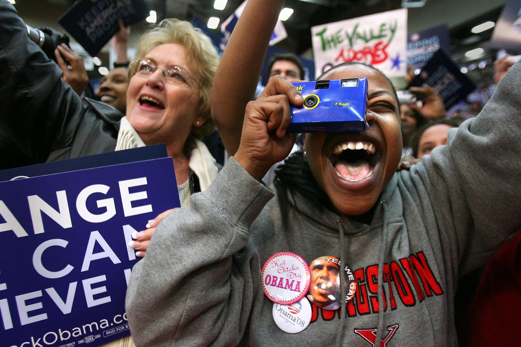 First Place, Photographer of the Year - Lisa DeJong / The Plain DealerJuanita White, 61 (left) of Canfield and  Jayme Stewart, 28, (right) a graduate student in social work at Youngstown State University, cheers for  presidential hopeful Barack Obama as he enters the Beeghly Center at Youngstown State University.