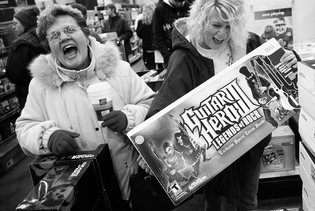 Second Place, Photographer of the Year - Michael E. Keating / Cincinnati EnquirerSally Whalen (left) and her daughter Michelle Tucker from Dayton, Ky. were happy to find Guitar Hero. At 5 am, the Best Buy in Florence, Ky. was teeming with bargain hunters on a Black Friday morning.  