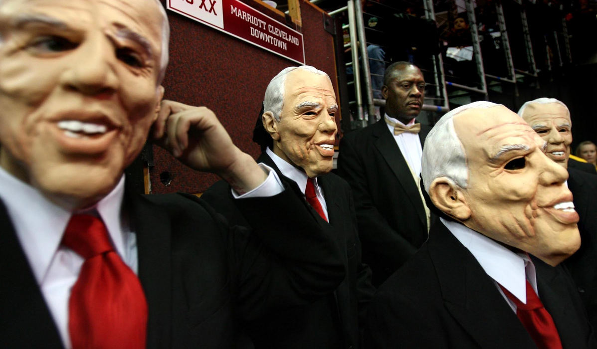 First Place, Photographer of the Year - Lisa DeJong / The Plain DealerMembers of the Cavaliers Scream Team sport John McCain Halloween masks before their half-time show at the game opener against the Charlotte Bobcats at Quicken Loans Arena  The Scream Team dance act did a presidential spoof to Michael Jackson's "Beat It'. 