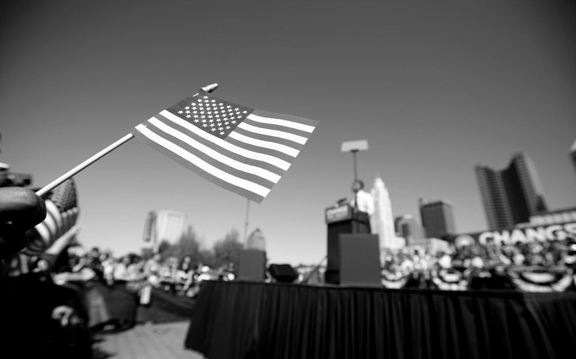 Second Place, Photographer of the Year - Michael E. Keating / Cincinnati EnquirerAt a Columbus rally, a flag held by a supporter is a symbol and a staple of every rally. 