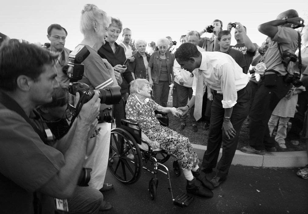 Second Place, Photographer of the Year - Michael E. Keating / Cincinnati EnquirerCandidate Barack Obama takes time to stop and hold the hand of an elderly woman in a wheelchair.  The stop was unscheduled and a small crowd gathered as word spread that the candidate had made the impromptu appearance.