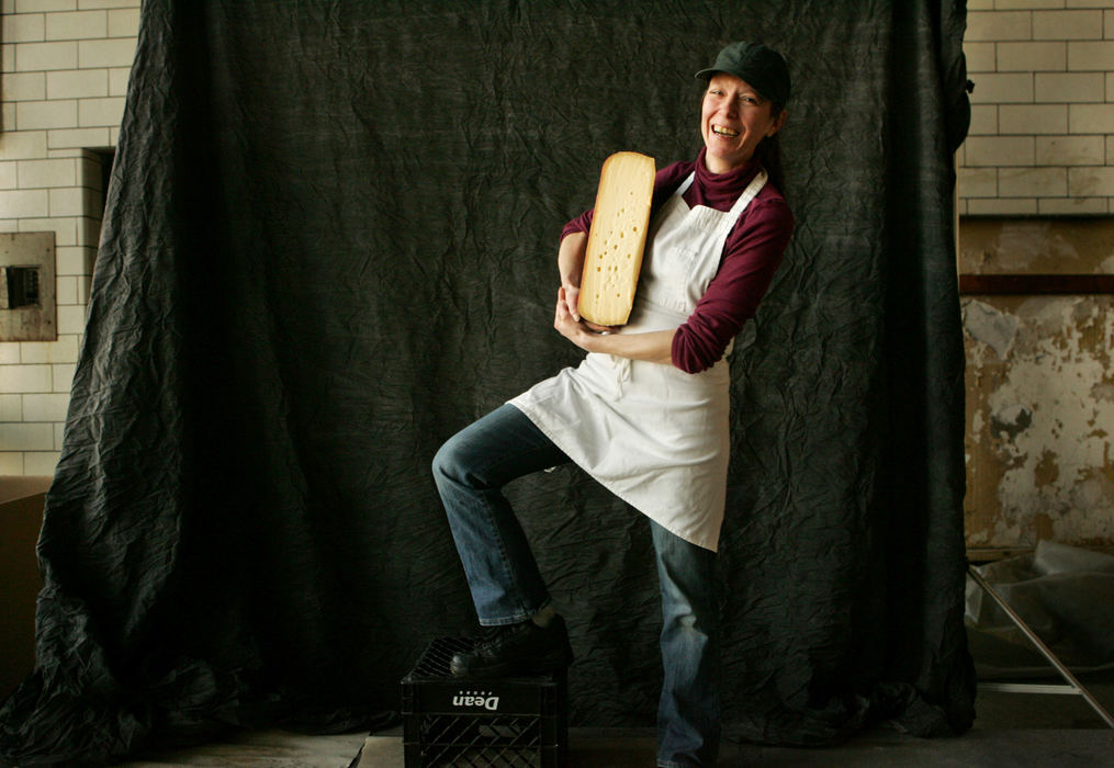 Third Place, Photographer of the Year - Gus Chan / The Plain DealerLisa Seppi sells gourmet cheeses at the West Side Market.  Seppi is one of the newer, younger vendors that are setting up stands at the market.