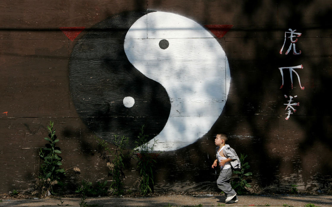 Third Place, Photographer of the Year - Gus Chan / The Plain DealerJoshua Olavarria, 3, walks past a former martial arts studio on E. 71 St.  Olavarria has lived on the street fro six months, having moved from the Tremont neighborhood.