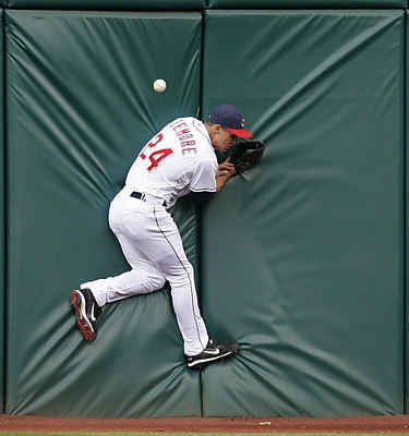 Award of Excellence, Sports Action - Tony Dejak / Associated PressCleveland Indians' Grady Sizemore jumps on the wall trying to catch a double hit by San Francisco Giants' Rich Aurilia in the fourth inning in a game at Progressive Field in Cleveland.