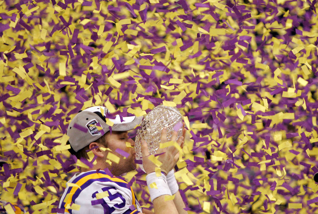Award of Excellence, Sports Feature - Joshua Gunter / The Plain DealerLSU QB Matt Flynn kisses the coaches trophy as LSU-colored confetti falls after LSU defeated OSU in the Allstate BCS National Championship game, January 07, 2008 at the Louisiana Superdome in New Orleans. 