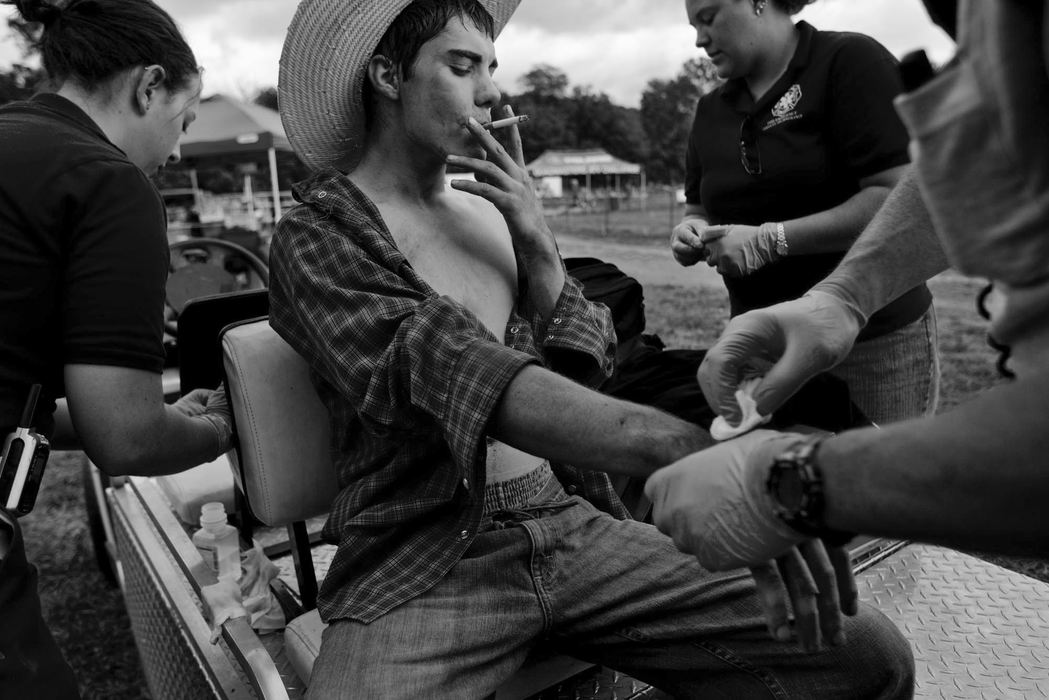 Second Place, Sports Feature - Diego James Robles / Ohio UniversityAustin Sutliff, 16, of Reading, Pa., receives medical aid from Hocking College emergency medical technicians after being thrown-off and stepped-on by a bull, on Sept. 28, 2008, in Nelsonville. A cowboy for the past four years, Sutliff competes in the Bull Ride Mania rodeo circuit and similar competitions.