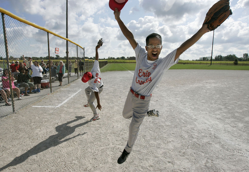 Third Place, Sports Feature - Dave Zapotosky / The BladeDrew Brown (left) and Seth Schmiesing, of the Erie County Bucks, celebrate a victory over the Darke County Warriors during the 2008 Special Olympics Ohio State Softball Tournament at the Coontz Recreation complex in Oregon, Ohio, September 6, 2008.  