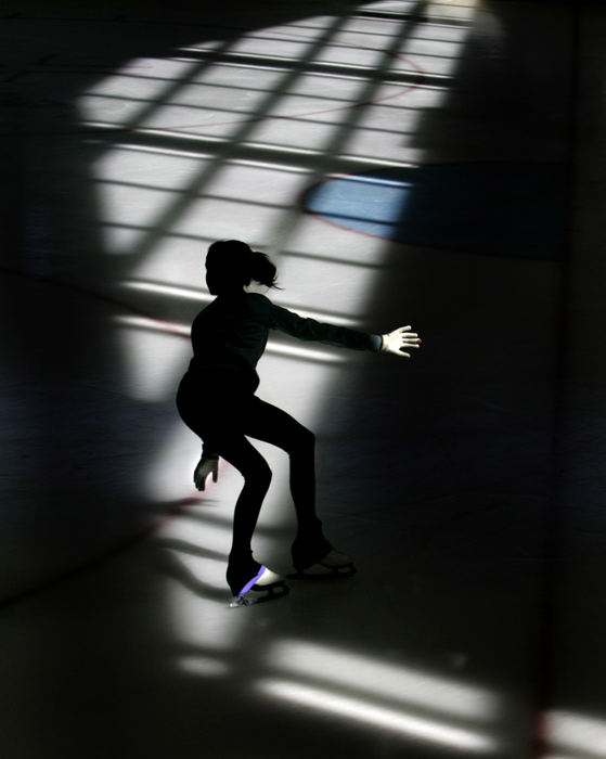 Award of Excellence, Sports Feature - Joshua Gunter / The Plain DealerHannah Rosinski, 13, of University Heights, skates across a patch of sunlight at the Cleveland Heights Community Center in June. Heights officials say their rink is thriving, but several other cities' rinks are struggling. 