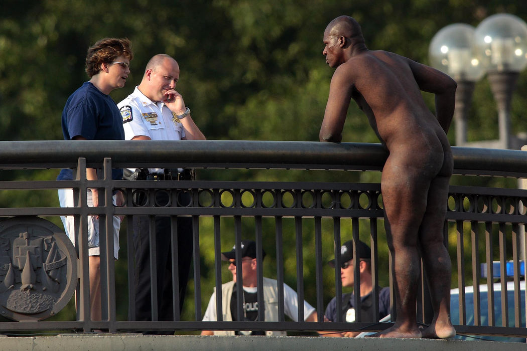 Third Place, Spot News over 100,000 - James D. DeCamp / The Columbus DispatchA NetCare crisis councilor and a Columbus Police Negotiator talk with a suicidal man who was threatening to jump from the Broad Street Bridge downtown, July 18, 2008.  After a two hour standoff, the man gave him self up without incident.