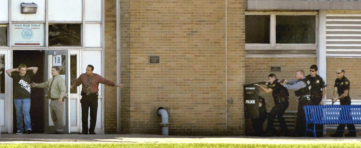 Third Place, Spot News under 100,000 - Duncan Scott / The News-HeraldThe suspect in a shooting incident at South High School in Willoughby is led out of the school by (from left) Assistant Principal Jeff Lyons and Principal Paul Lombardo. The student, described as a 10th-grader, fired shots in the cafeteria before Lyons and Lombardo talked him into surrendering.