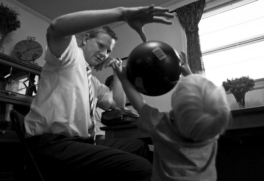 First Place, Student Photographer of the Year - Diego James Robles / Ohio UniversityElder Merrill plays keep-away from one of the church’s youngest member, Bryce Peterson, 2, in The Plains.