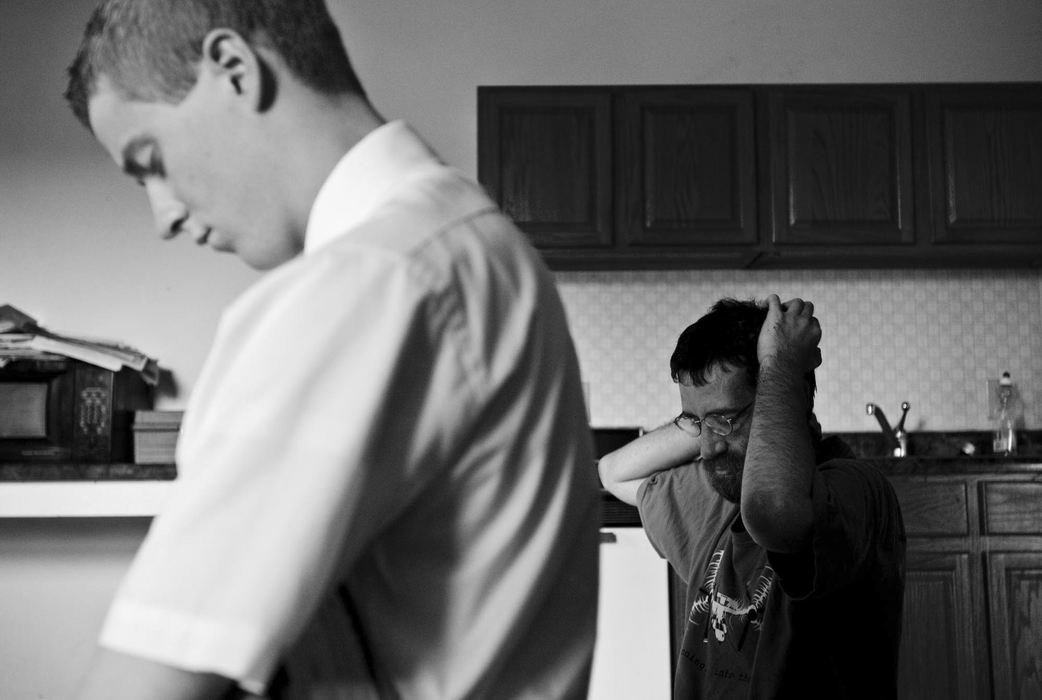 First Place, Student Photographer of the Year - Diego James Robles / Ohio UniversityElder Barker, fresh off his new transfer, prays with David, a local town personality in The Plains.