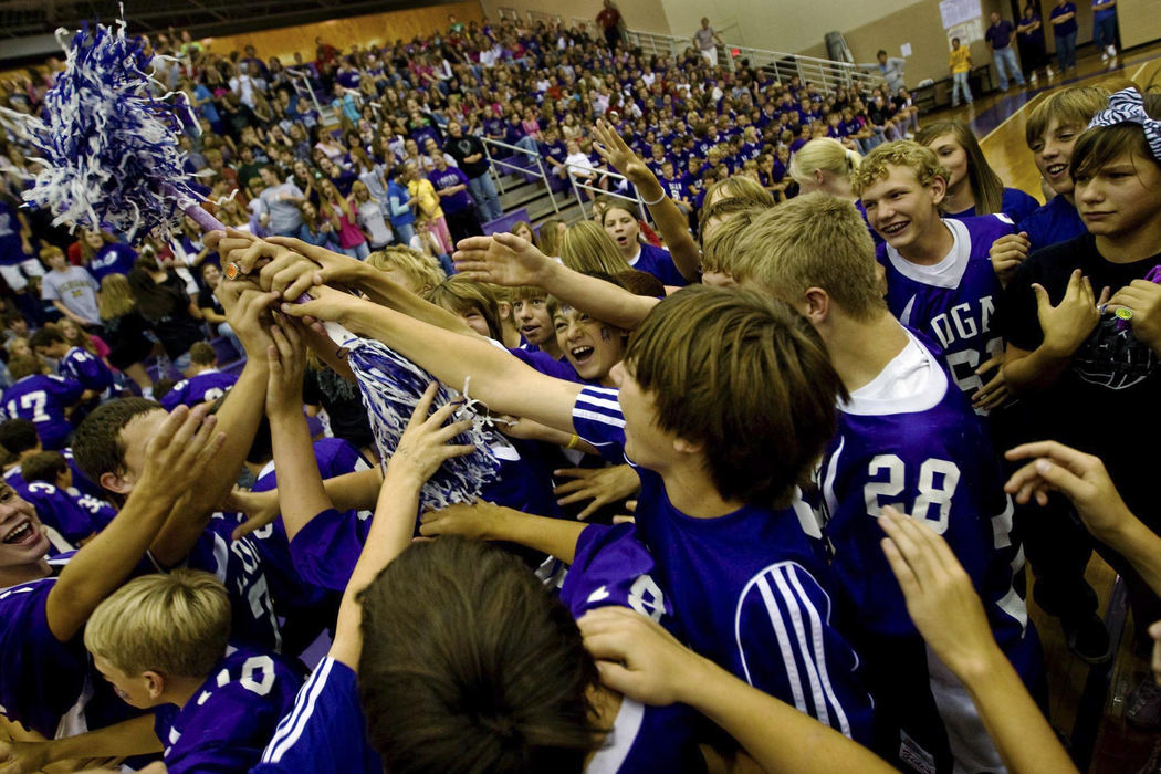 First Place, Student Photographer of the Year - Diego James Robles / Ohio UniversityJunior high students struggle to touch a symbolic victory baton in a pep rally for the Logan Chieftains.