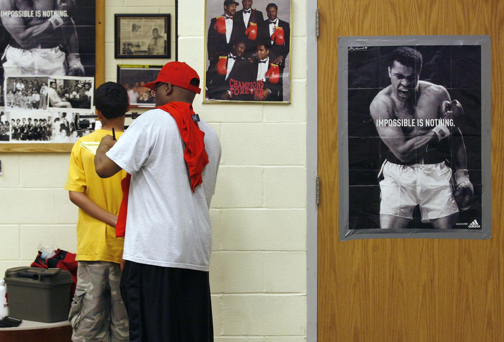 Second Place, Sports Picture Story - Andrea Kjerrumgaard / The Columbus DispatchTerrell Fairrow is weighed-in for a boxing tournament at the Blackburn Recreation Center in Columbus, April 25, 2008.  
