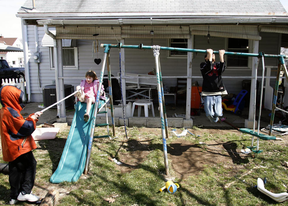 Second Place, Sports Picture Story - Andrea Kjerrumgaard / The Columbus DispatchTerrell Fairrow plays in the backyard with his siblings Josiah Kennedy, 7, and TreAnna Kuntz, 4, on a Sunday afternoon.  The three, along with an older sister, Jazmine, 13, live with their great-grandparents.  