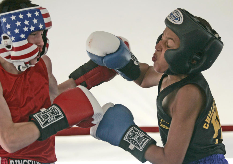 Second Place, Sports Picture Story - Andrea Kjerrumgaard / The Columbus DispatchTerrell Fairrow, 11, boxes 12-year-old Travis Jerig of Zanesville in the Ross County Police Athletic League tournament on June 14, 2008, at the Nourse Auto Mall in Chillicothe.  Fairrow lost the fight in a split-decision. 