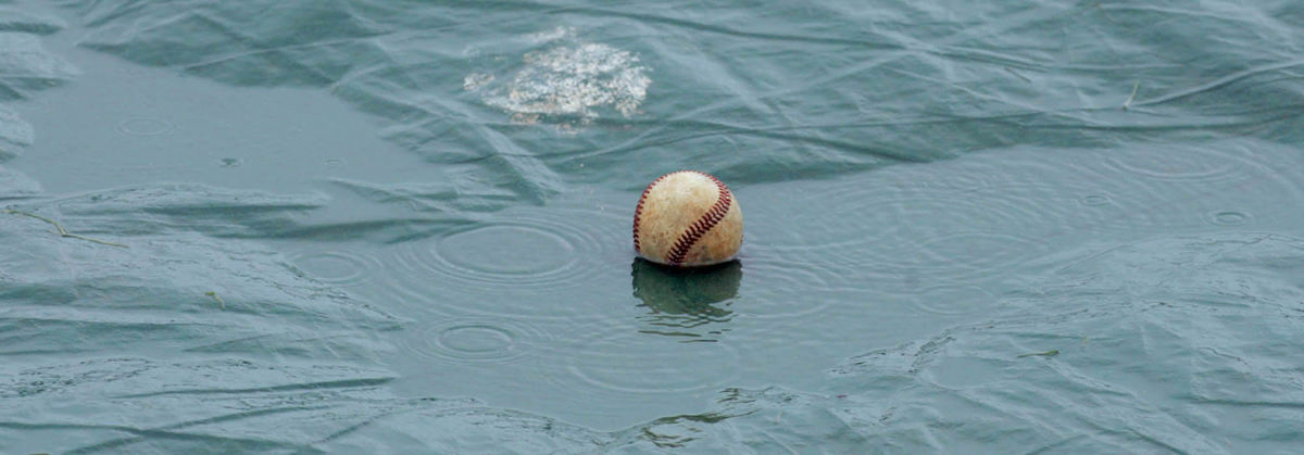 Third Place, Sports Picture Story - Phil Masturzo / Akron Beacon JournalA soggy baseball sits on the tarp.
