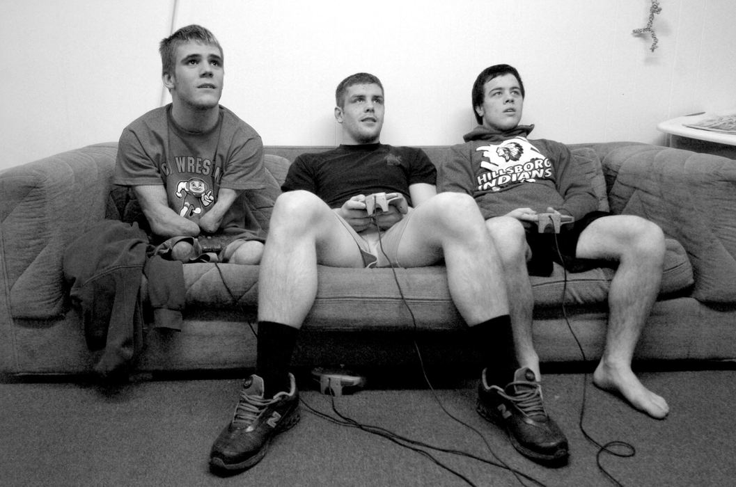 First Place, Sports Picture Story - Michael E. Keating / Cincinnati EnquirerDustin Carter is a regular kids in every way, but he has no arms and legs.  Still he takes his place on a sofa in the locker room to play video games with his friends. 
