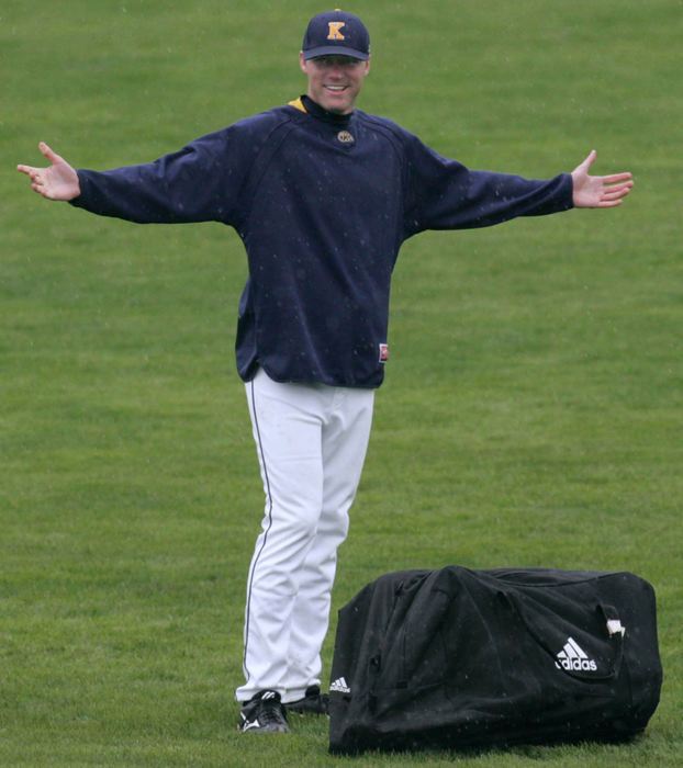 Third Place, Sports Picture Story - Phil Masturzo / Akron Beacon JournalKent State pitcher Steve Ross went out to investigate an equipment bag left on the field by the opponents. 