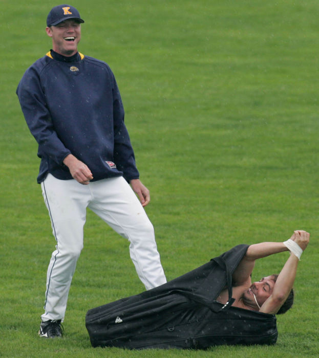 Third Place, Sports Picture Story - Phil Masturzo / Akron Beacon JournalKent State pitcher Steve Ross was surprised to find University of Akron's Nick Solitario, wearing only an undergarment and bound in tape, inside the equipment bag. 