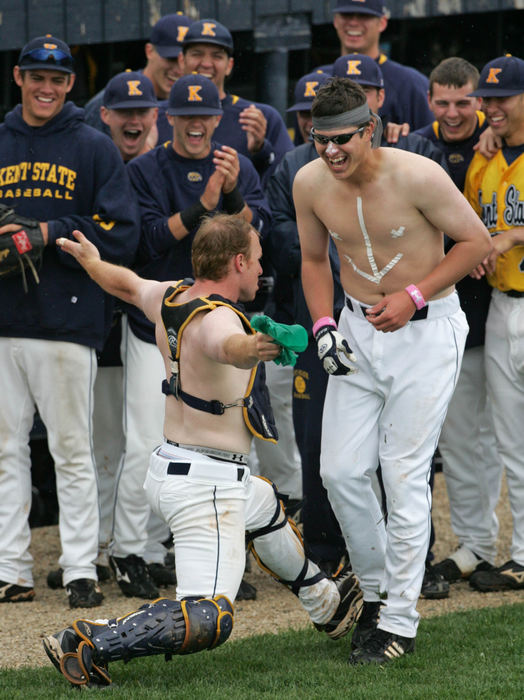 Third Place, Sports Picture Story - Phil Masturzo / Akron Beacon JournalKent State catcher Cory Hindel's competes in a dance off with University of Akron's Doug McNulty.