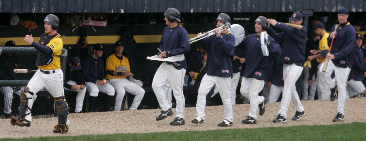 Third Place, Sports Picture Story - Phil Masturzo / Akron Beacon JournalKent State catcher Cory Hindel's formed a marching band with teammates and makeshift articles from the dugout. 